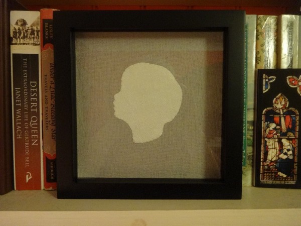 Silhouette head: silk on linen made by Mary Addison