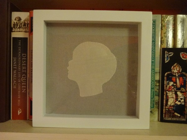 Silhouette head: silk on linen made by Mary Addison