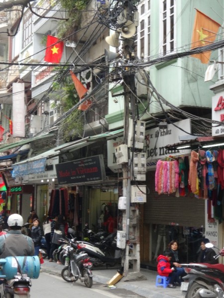 Hanoi, the old town:  electricity cables and a useful post