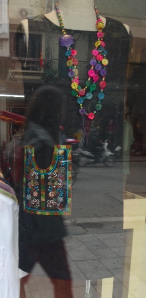 Modern Vietnamese embroidery: dress with embroidered pocket (photographed through a shop window)