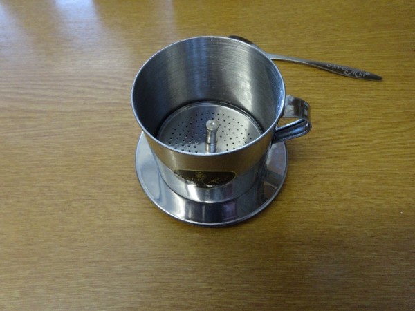Vietnamese coffee filter showing free-moving  filter beneath which is the fixed filter