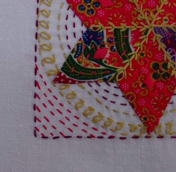 Detail of fifteenth  embellished patchwork star (hand embroidered by Mary Addison)