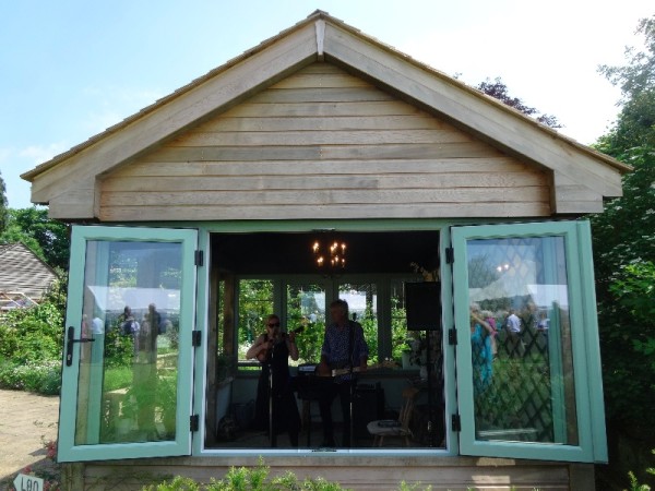 Aaron and Aitch McRobbie performing in the garden house 